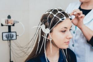 Woman getting an EEG scan to see how she can improve her mental health